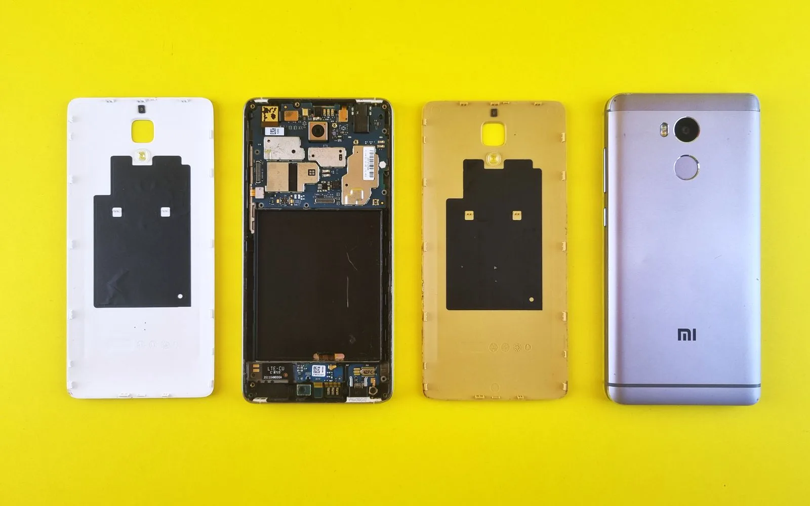 Phone back panels removed, showing the internal components that sit underneath the glass