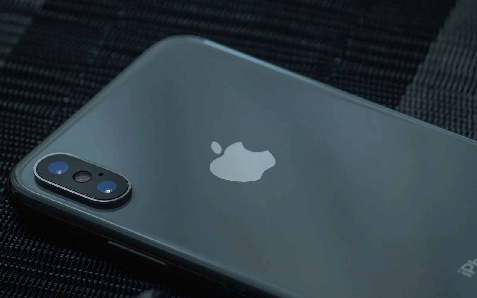 Close up of the glass back panel of an iPhone