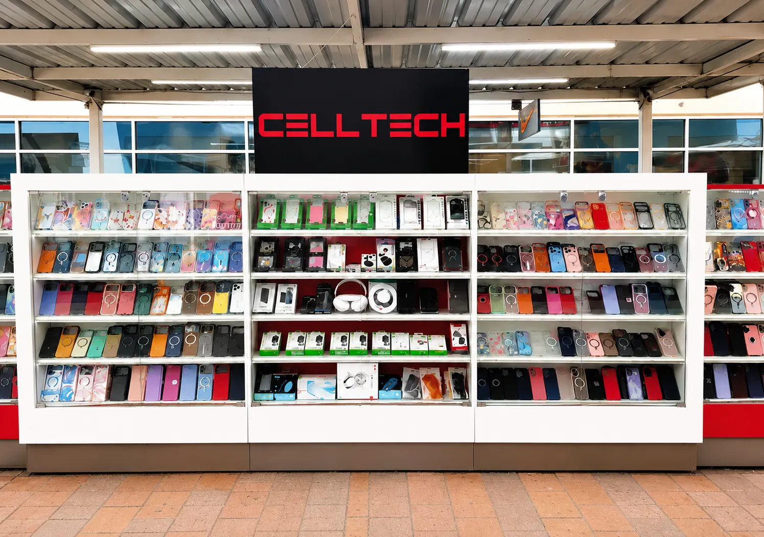 The CELLTECH unit at Grand Prairie Premium Outlets, its sign above three lit cabinets of phone cases and accessories