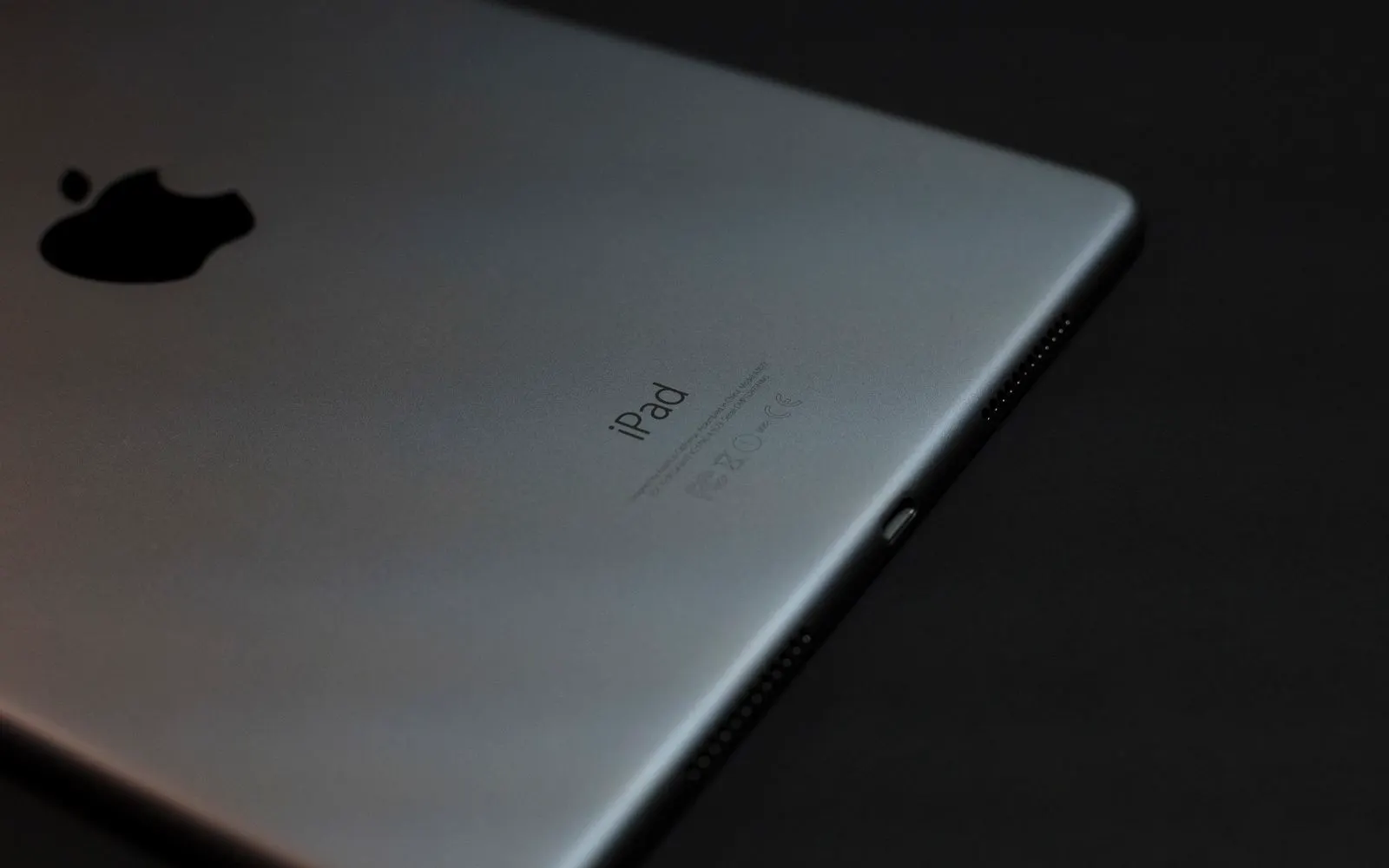 A tablet standing against a dark background