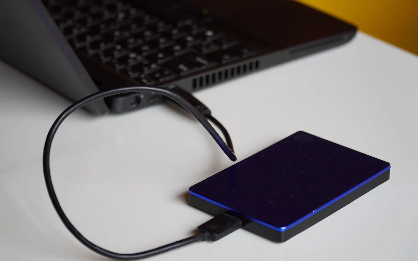 An external hard drive connected to a laptop