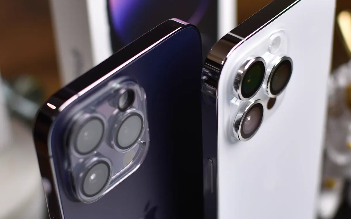 An iPhone 14 Pro Max seen from the back, its camera array in focus