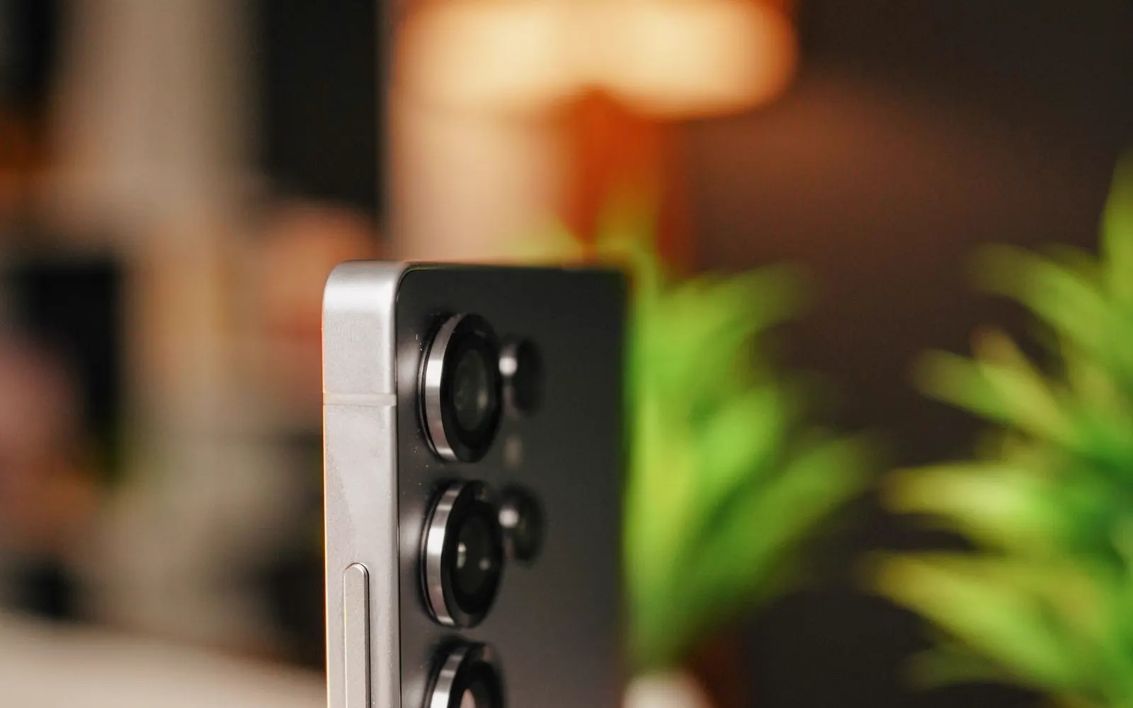 The three rear camera lenses on the edge of a Galaxy phone