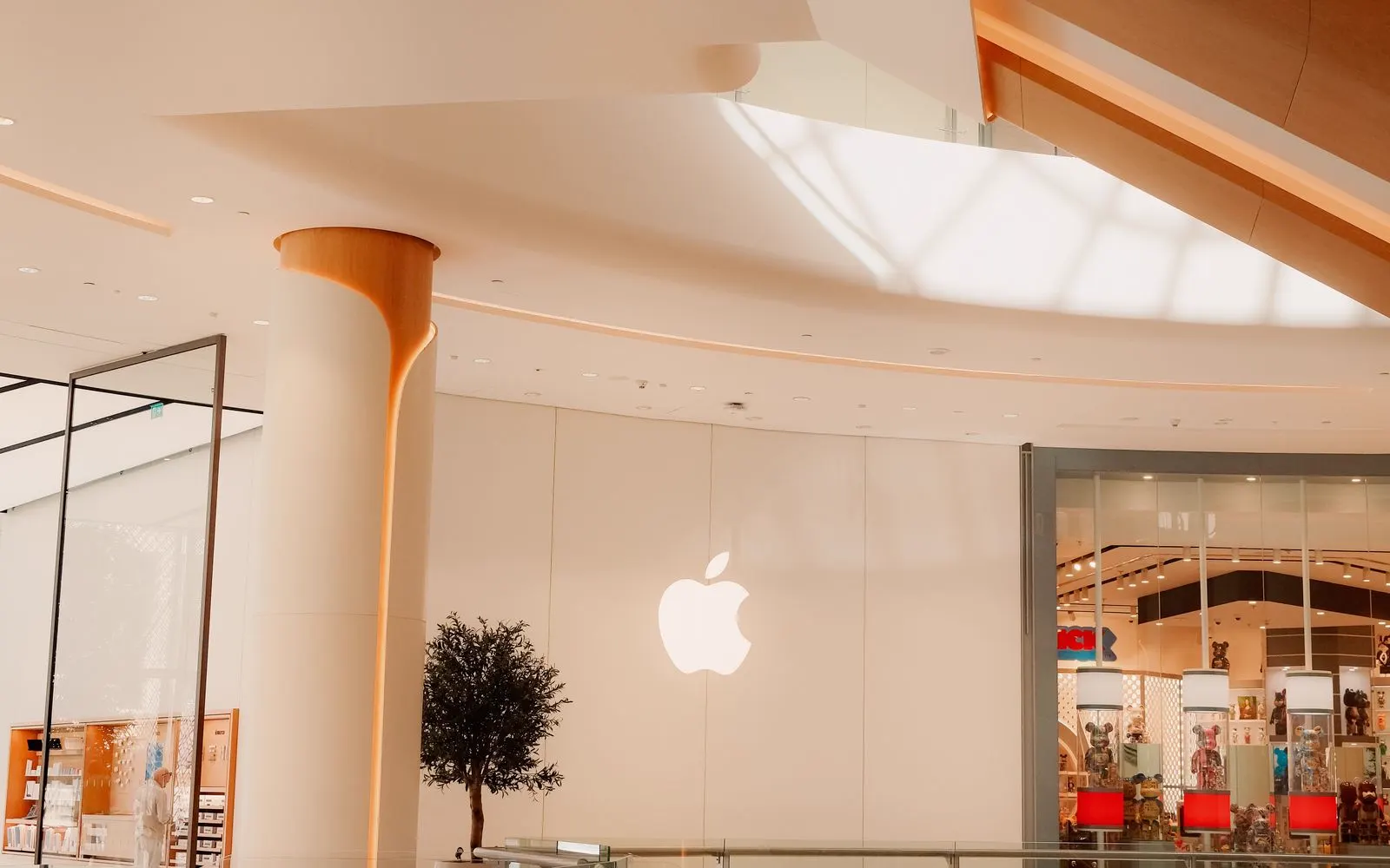 An Apple Store unit inside a shopping mall, seen from the concourse