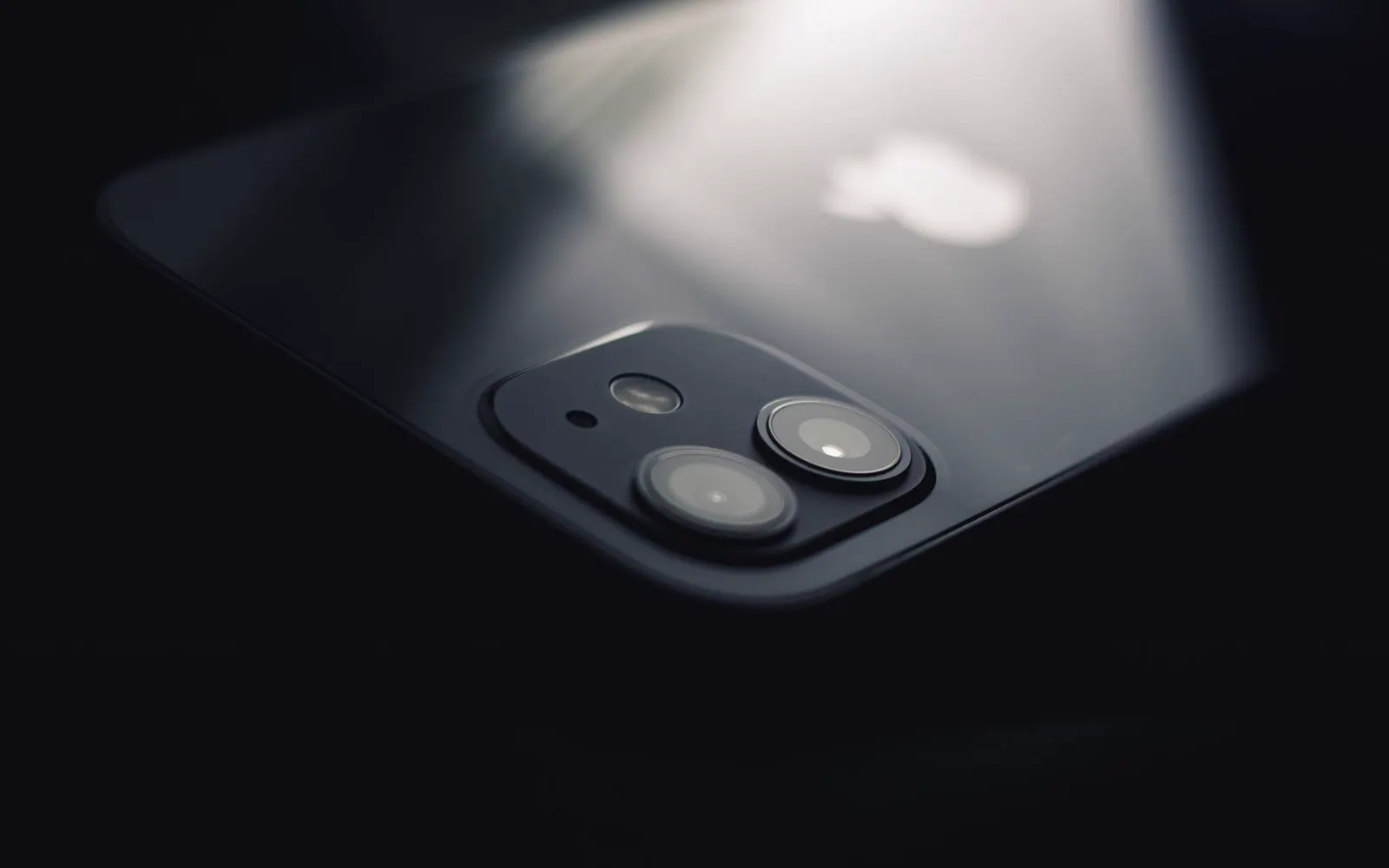 A close-up of a smartphone camera lens catching the light
